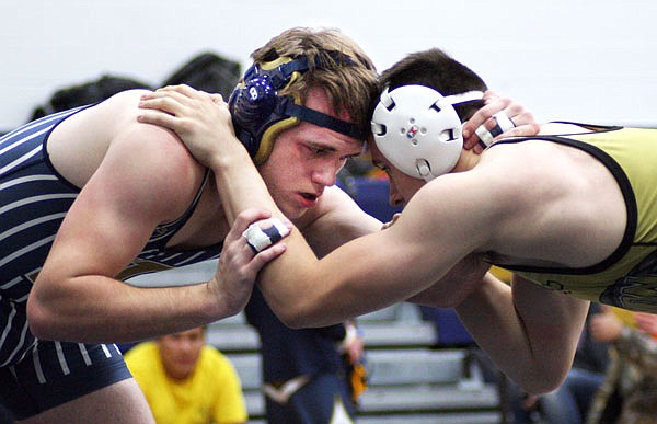 Helias junior Colden Imhoff looks to make a move against Lebanon's Jon Berry during a match Friday night in the Missouri Duals at Rackers Fieldhouse.