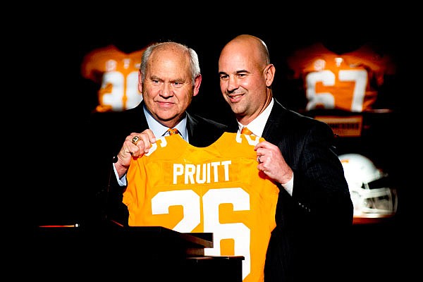 Tennessee athletic director Phillip Fulmer (left) introduces Jeremy Pruitt as Tennessee's next head football coach during his introduction ceremony Thursday in Knoxville, Tenn.