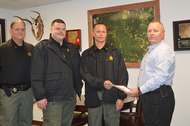 Miller County Sheriff Jackie Runion, right, presents a certificate of appreciation to deputies Sgt. Alan Sanders and Cpls. Don Rodgers and Richard Henderson. The men received the honor for saving the life of an inmate on Oct. 31. (Submitted photo)
