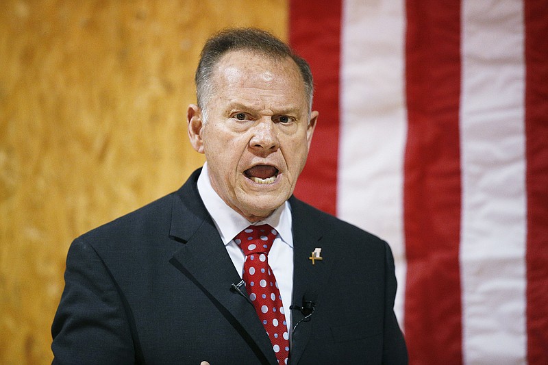 FILE- In this Nov. 30, 2017 file photo, former Alabama Chief Justice and U.S. Senate candidate Roy Moore speaks at a campaign rally, in Dora, Ala. Most statewide Republican officeholders in Alabama say they're voting for Moore for U.S. Senate, but the state's senior U.S. Sen. Richard Shelby didn't vote for Moore. Polls show Moore in a tight race with Democrat Doug Jones. (AP Photo/Brynn Anderson, File)