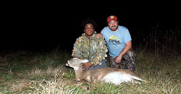 Chris Brown and Brandon Butler pose with a doe Chris took on his fifth deer hunt of the year.