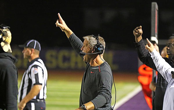 Jefferson City football coach Ted LePage signals from the sidleline during a district game this past season at Blue Springs. LePage announced he was stepping down from the position Sunday. 