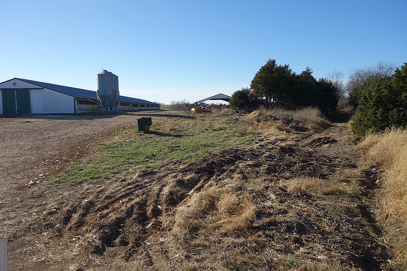 The right-of-way of deconstructed Rock Island Line seen above passes through Mark Chamberlin's dairy and poultry farm. (News Tribune photo/Allen Fennewald)                 