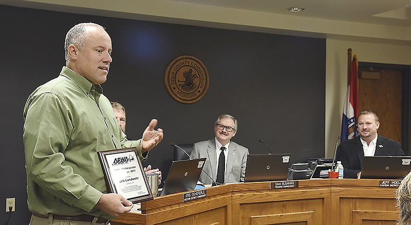 Eric Landwehr was presented a plaque at Tuesday's Cole County Commission meeting. He was acknowledged with the Missouri Chapter APWA or American Public Works Association Public Works Leader of the Year. He spoke briefly before the commissioners about receiving the honor. 