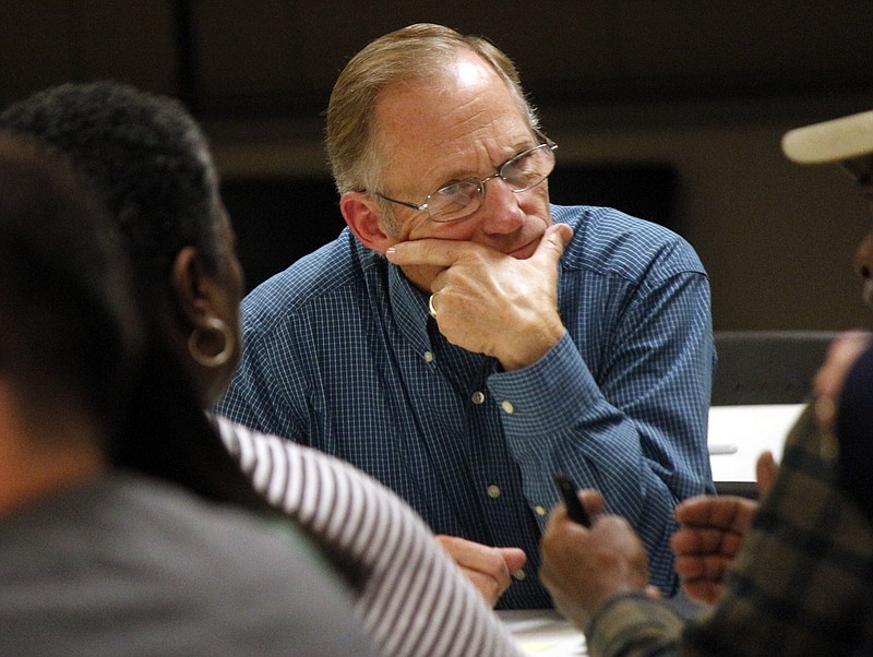 Eugene Vogel listens intently to a community member about their thoughts on what the role of schools are when it comes to the topic of diveristy during the Jefferson City Public Schools Diversity Discussion in the Hawthorn Bank Community Room on Tuesday, Nov. 7, 2017. Attendees gathered in groups of six at each table in the room to discuss their viewpoints on diversity in the community.