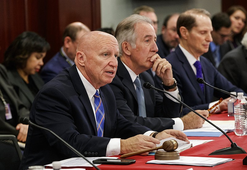 From left, House Ways and Means Committee Chairman Kevin Brady, R-Texas, Rep. Richard Neal, D-Mass., ranking member of the House Ways and Means Committee, and Sen. Ron Wyden, D-Ore., the top Democrat on the Senate Finance Committee, and other tax conferees gather to work on the sweeping overhaul of the nation's tax laws, on Capitol Hill in Washington, Wednesday, Dec. 13, 2017. Democrats are objecting to the bill and are asking that a final vote be delayed until Senator-elect Doug Jones of Alabama is seated. 