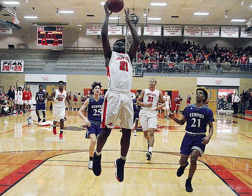 Garrett Parker of Jefferson City goes up to the hoop during Wednesday night's game against Hickman at Fleming Fieldhouse.