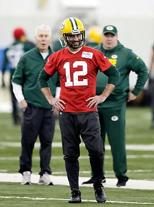 Packers quarterback Aaron Rodgers smiles during practice Wednesday in Ashwaubenon, Wis.