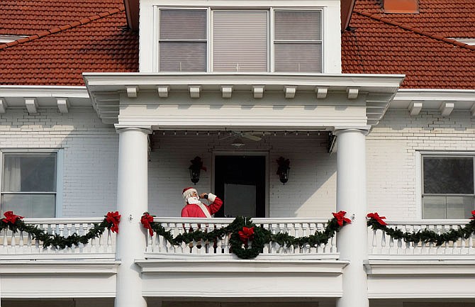 Santa lives on the second-story porch at this house at the top of Court Street in Fulton. He is a favorite symbol of the season among some Fulton residents.