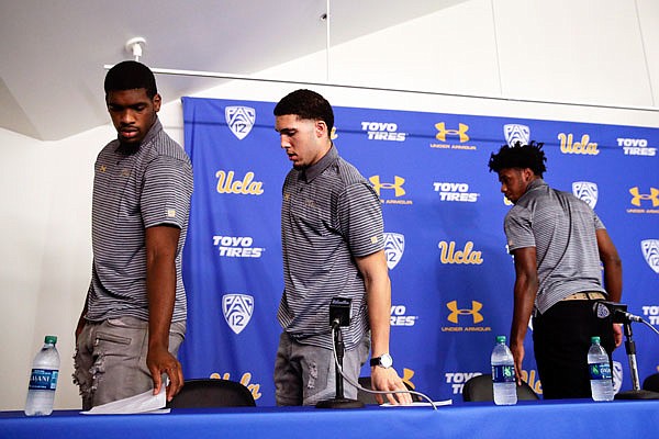 (From left) UCLA players Cody Riley, LiAngelo Ball and Jalen Hill leave after giving their statements last month during a news conference in Los Angeles. The players were detained in China following allegations of shoplifting. Ball has left the program while the other two players could soon learn their fates at UCLA.