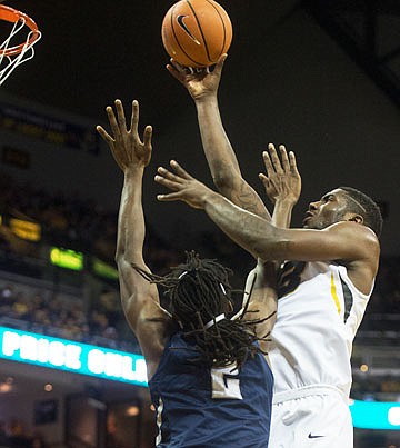 Missouri's Jeremiah Tilmon shoots above North Florida's Wajid Aminu during Saturday night's game at Mizzou Arena.