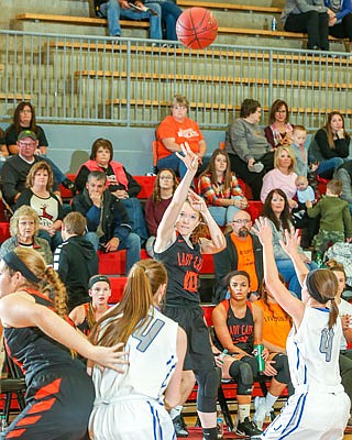 Kylie Quinn of the New Bloomfield Lady Wildcats puts up a shot Saturday against Jamestown at Fleming Fieldhouse.