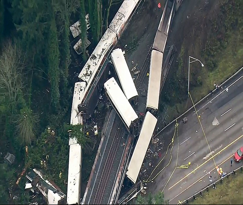 This image from video provided by KOMO-TV, shows the site of an Amtrak train that derailed south of Seattle on Monday, Dec. 18, 2017. Authorities reported "injuries and casualties." The train derailed about 40 miles (64 kilometers) south of Seattle before 8 a.m., spilling at least one train car on to busy Interstate 5.