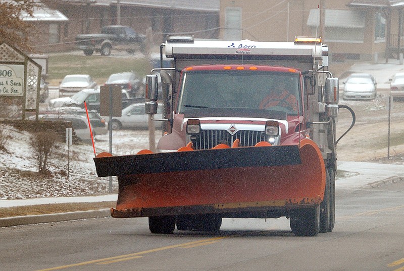 Trucks equipped with plows were seen throughout Jefferson City in anticipation of snowfall.
