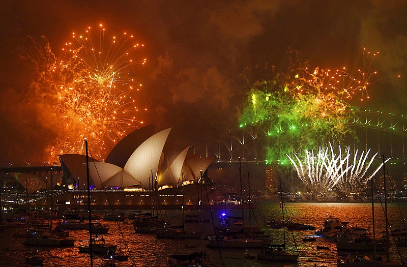 Fireworks explode over Sydney Harbour during New Year's Eve celebrations in Sydney, Australia, Sunday, Dec. 31, 2017. (David Moir/AAP Image via AP)