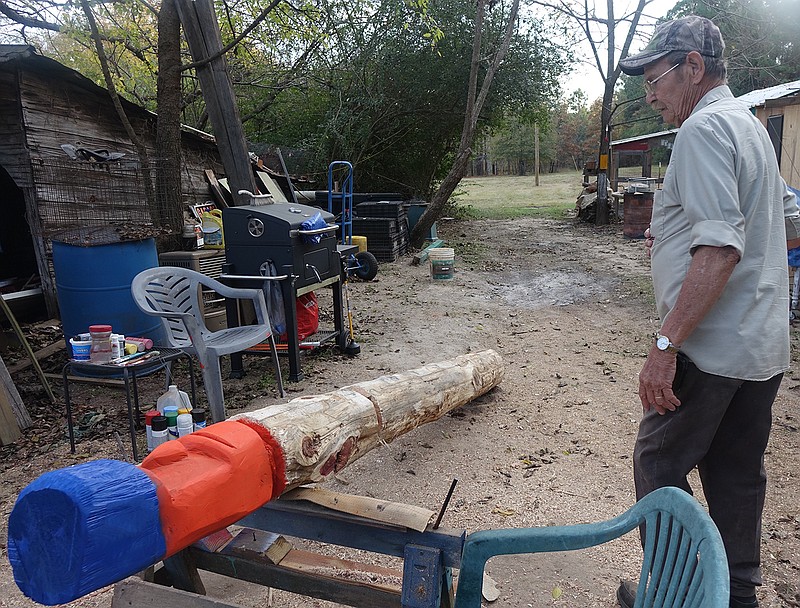  Here's the way a cedar pole becomes a totem pole in the hands of Don Combs of Kildare, Texas.
