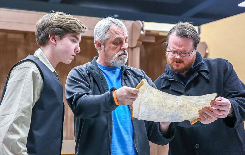 From left, Evan Backues as Jim Hawkins, Barry Beach as Dr. Livesey and William Runyan Jr. as Squire Trelawney review a treasure map in a scene for the upcoming Little Theatre production of Treasure Island.