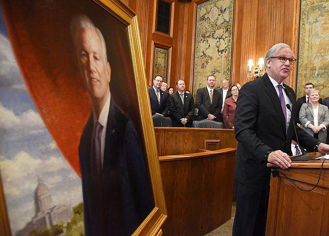 Former Gov. Jay Nixon offers a few comments upon presentation of his official portrait Thursday in the Senate Lounge.