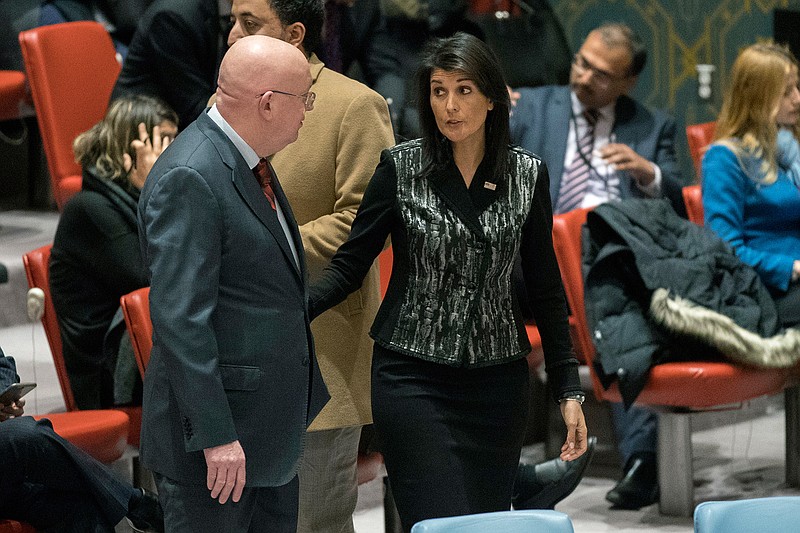 Russian Ambassador to the United Nations Vasily Nebenzya, left, speaks to American Ambassador to the United Nations Nikki Haley before a Security Council meeting on Iran, Friday, Jan. 5, 2018, at United Nations headquarters.