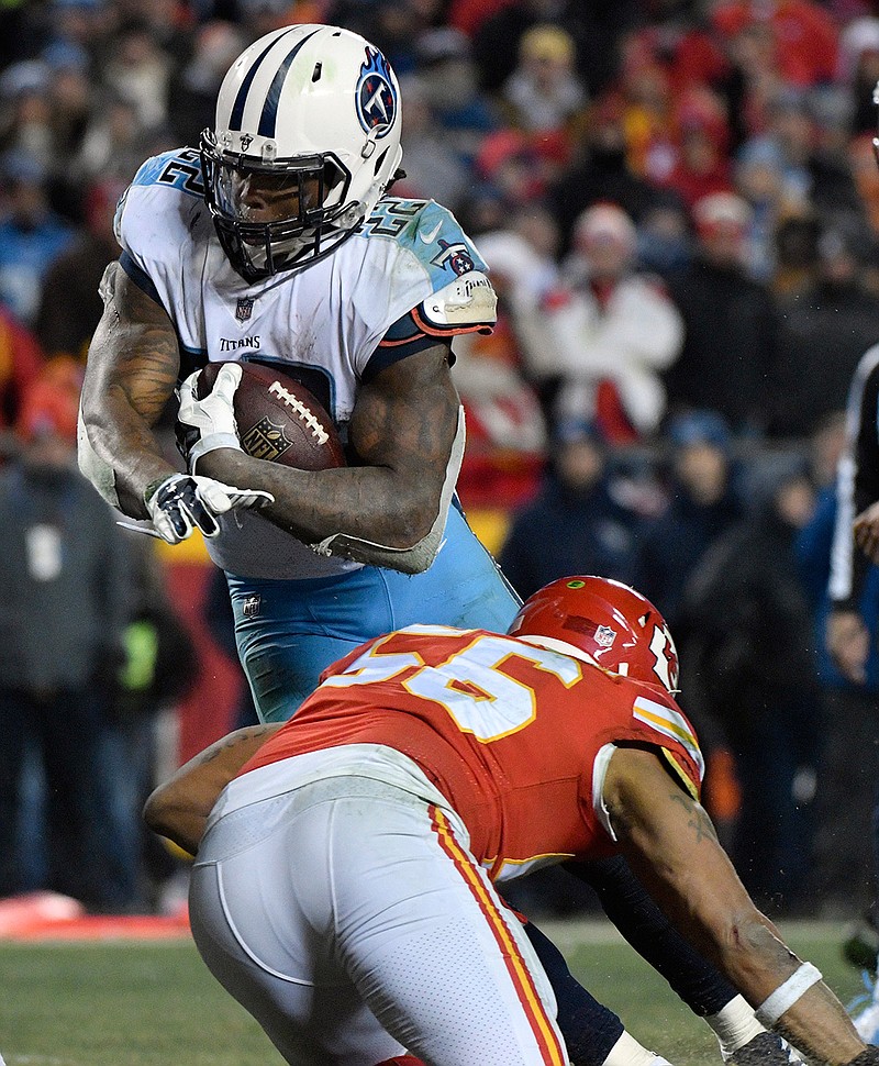 Tennessee Titans running back Derrick Henry (22) avoids a tackle by Kansas City Chiefs linebacker Derrick Johnson (56) during the second half of an NFL wild-card playoff football game, in Kansas City, Mo., Saturday, Jan. 6, 2018. 