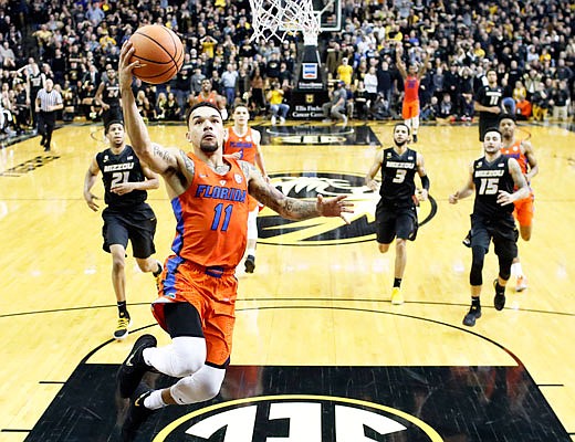 Florida's Chris Chiozza goes up for a layup to score the game-winning basket in the final seconds of Saturday afternoon's game against Missouri at Mizzou Arena.