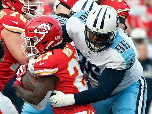 Chiefs running back Kareem Hunt is tackled by Titans nose tackle Sylvester Williams during the first half of Saturday's game at Arrowhead Stadium. Williams, a former Jefferson City Jay, had two solo tackles and one sack in the game.
