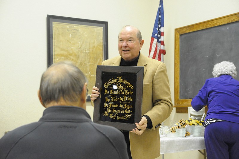 Moniteau County Historic Society past president Paul Jungmeyer shared a German blessing wall hanging that hung in his grandparents' home after they were married in 1901 at the Jan. 8 "show and tell" meeting.