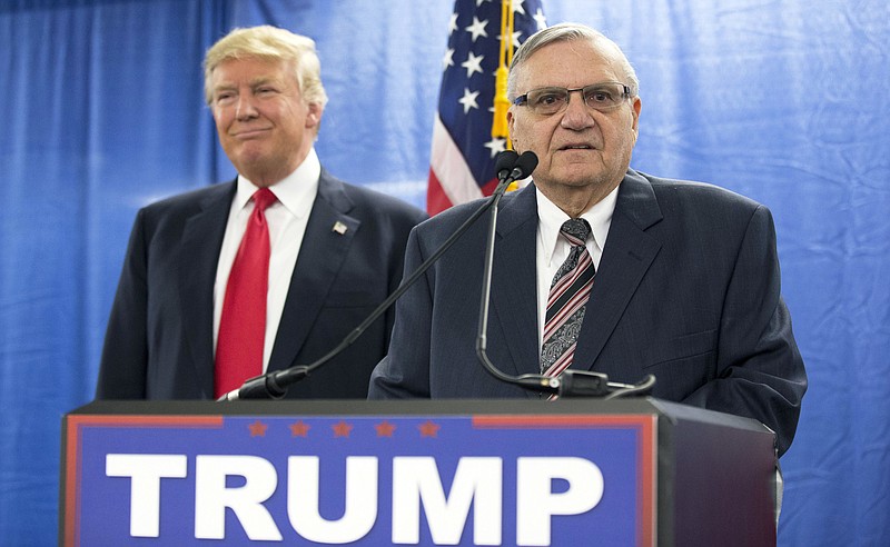 FILE - In this Jan. 26, 2016, file photo, Republican presidential candidate Donald Trump is joined by Joe Arpaio, the sheriff of metro Phoenix, during a news conference in Marshalltown, Iowa. Former Phoenix lawman and Trump ally Arpaio says he will run for the Arizona U.S. Senate seat held by Jeff Flake. (AP Photo/Mary Altaffer, File)