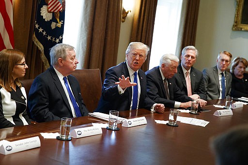 President Donald Trump speaks during a meeting with lawmakers on immigration policy in the Cabinet Room of the White House, Tuesday, Jan. 9, 2018, in Washington. (AP Photo/Evan Vucci)