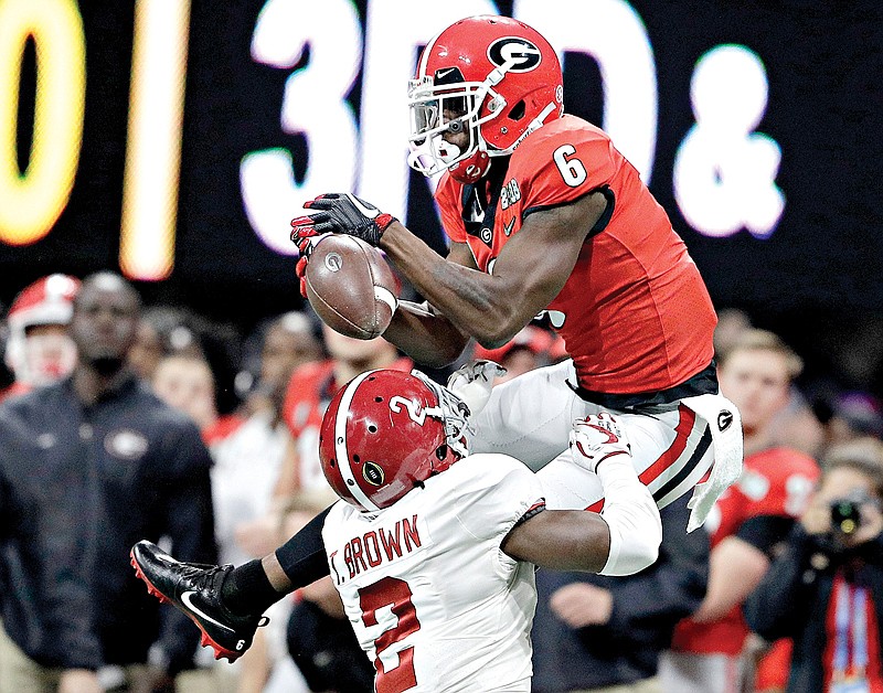 Alabama's Tony Brown breaks up a pass intended for Georgia's Javon Wims during the first half of the College Football Playoff championship game Monday in Atlanta.

