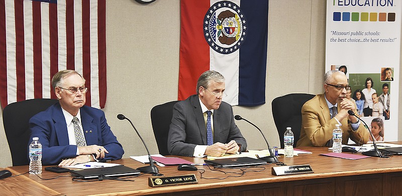 Board members, from left, A. Victor Lenz, Charlie Shields and Michael Jones listen to comments Monday, Jan. 8, 2018, during a public hearing at the State Board of Education. The hearing was scheduled for the hiring of a new commissioner of education for the state of Missouri.