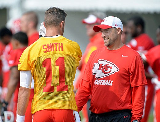 In this Aug. 5, 2015, file photo, Matt Nagy talks with quarterback Alex Smith during Chiefs training camp in St. Joseph. Nagy was named head coach of the Bears on Monday.