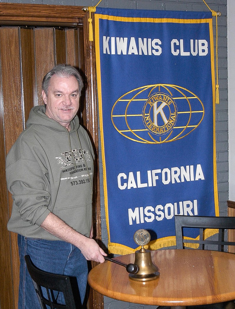 California Kiwanis President Jeff Shackleford rings the bell to call the meeting to order Jan. 8 at the new meeting location at Burgher Haus.