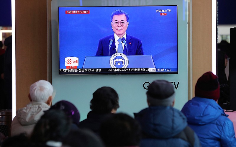 People watch a live broadcast of South Korean President Moon Jae-in's New Year's speech at the Seoul Railway Station in Seoul, South Korea, Wednesday, Jan. 10, 2018. Moon said he'll push for more talks and cooperation with North Korea to resolve the nuclear standoff, a day after the two Koreas held high-level talks for the first time in two years and agreed to cooperate in next month's Winter Olympics in South Korea.