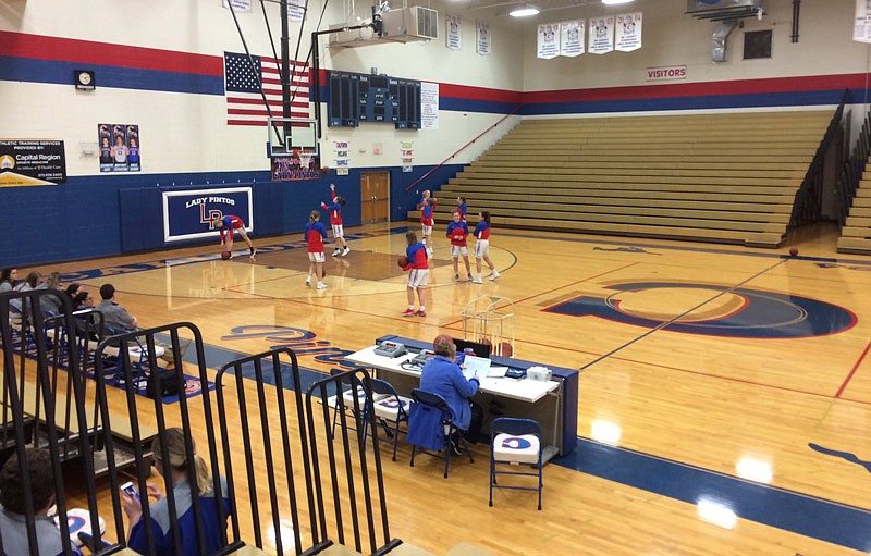 Lady Pintos players warm up in California's gym for their basketball contest against Fulton Tuesday Jan. 9, 2018.