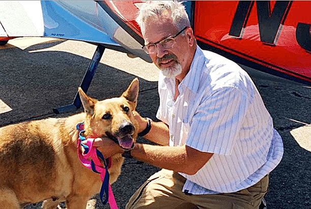 This photo provided by Best Fur Friends Rescue, shows Dr. Bill Kinsinger with Jojo, a dog from Fort Worth Animal Care & Control, on June 6, 2016, at a regional airport in northern Illinois. The search for Kinsinger, whose plane went missing last week over the Gulf of Mexico, was called off.