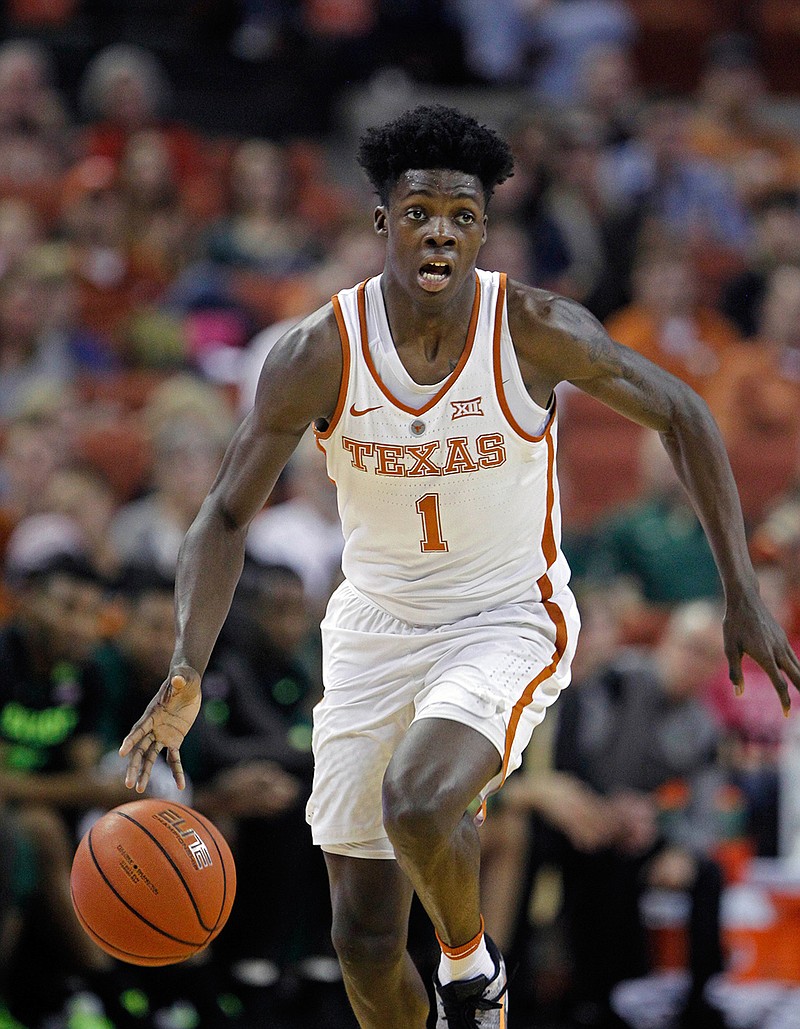  In this March 4, 2017, file photo, Texas guard Andrew Jones dribbles the ball during the second half of an NCAA college basketball game against Baylor, in Austin, Texas. Texas announced, Wednesday, Jan. 10, 2018, that sophomore guard Andrew Jones has leukemia and has started treatment. Jones was the Longhorns leading scorer before he was sidelined by a broken wrist. He played sparingly in his return after complaining of low energy and was sent for tests. 