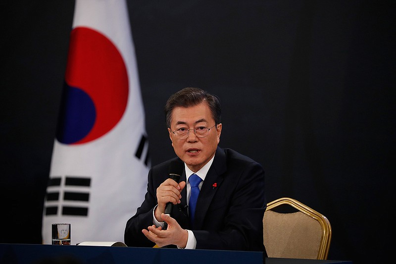 South Korean President Moon Jae-in answers reporters' question during his New Year news conference at the Presidential Blue House in Seoul, South Korea, Wednesday, Jan. 10, 2018. Moon said Wednesday he's open to meeting with North Korean leader Kim Jong Un if certain conditions are met, as he vowed to push for more talks with the North to resolve the nuclear standoff. 