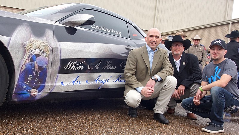 The project of creating a unique car to honor fallen Texas officers brings together, from left, Mike Rinehart of Atlanta's East Texas Wraps; Byron Colston of Sanger, Texas, and founder of Cops 4 Cops Texas; and Brandon Barnett of Ink Wrap Shop, Tulsa, Okla.