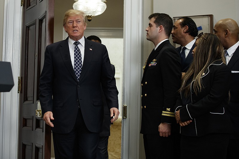 President Donald Trump arrives to an event to honor Dr. Martin Luther King Jr., in the Roosevelt Room of the White House, Friday, Jan. 12, 2018, in Washington. (AP Photo/Evan Vucci)