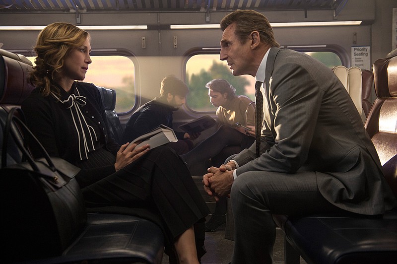 This image released by Lionsgate shows Vera Farmiga, left, and Liam Neeson in a scene from "The Commuter." (Jay Maidment/Lionsgate via AP)