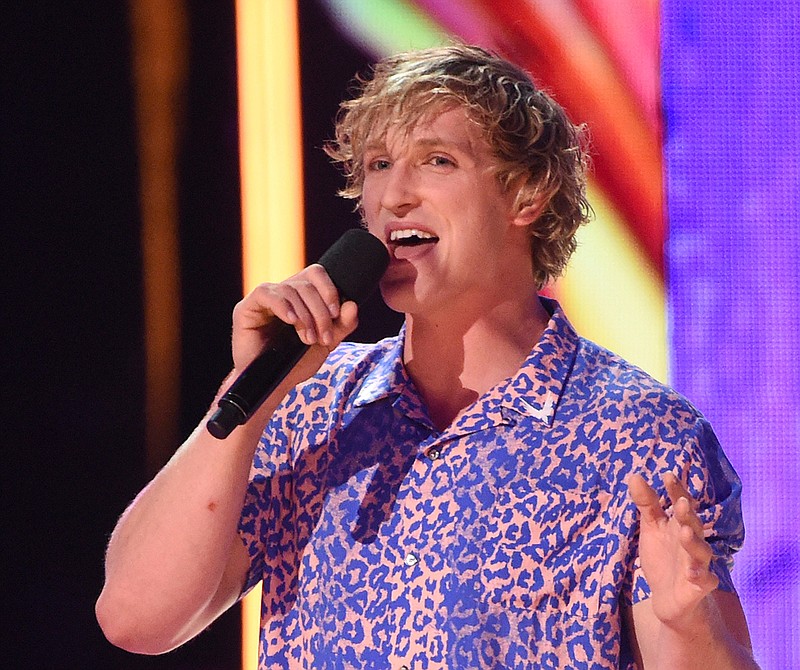 In this Aug. 13, 2017, file photo, Logan Paul introduces a performance by Kyle & Lil Yachty and Rita Ora at the Teen Choice Awards at the Galen Center in Los Angeles. YouTube says it has removed blogger Logan Paul's channels from Google Preferred and will not feature him in the new season of "Foursome." Paul's new video blogs also are on hold after he shared a video on YouTube that appeared to show a body hanging in a Japanese forest that is said to be a suicide spot. 