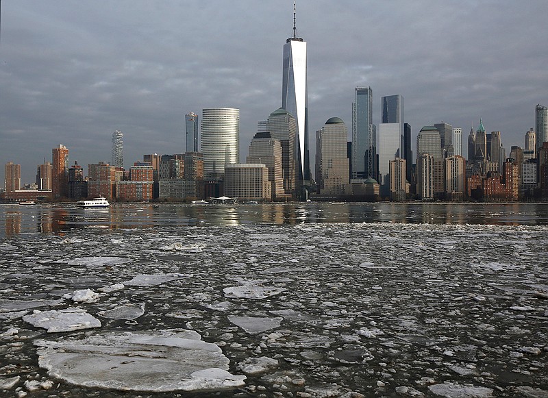 With the lower Manhattan skyline as a background, ice floats in the Hudson River, Thursday, Jan. 11, 2018, as seen from Jersey City, N.J. Temperatures rose into the 50's Thursday in a January thaw that provided relief after a stretch of bitter cold.