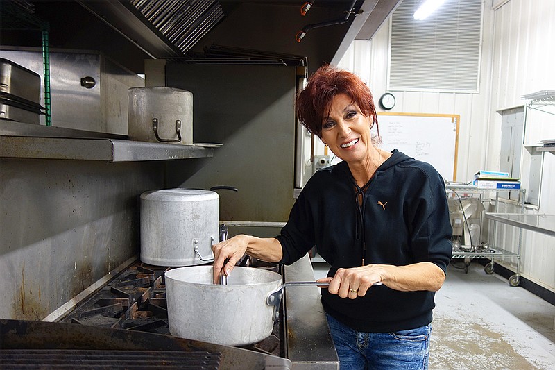 Mary Evans, co-owner and co-found of Signature Foods (located just outside Millersburg), stirs a pot Thursday. Signature Foods provides meals for the Callaway County Jail, along with another correctional facility, several nursing homes and other facilities.