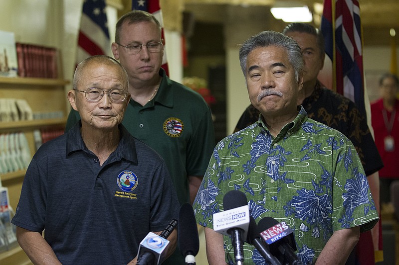 Vern Miyagi, Administrator, HEMA, left, and  Hawaii Gov. David Ige addressed the media  Saturday, Jan. 13, 2018, during a press conference at the Hawaii Emergency Management Center at Diamond Head Saturday following the false alarm issued of a missile launch on Hawaii. A push alert that warned of an incoming ballistic missile to Hawaii and sent residents into a full-blown panic was a mistake, state emergency officials said.  (George F. Lee  /The Star-Advertiser via AP)