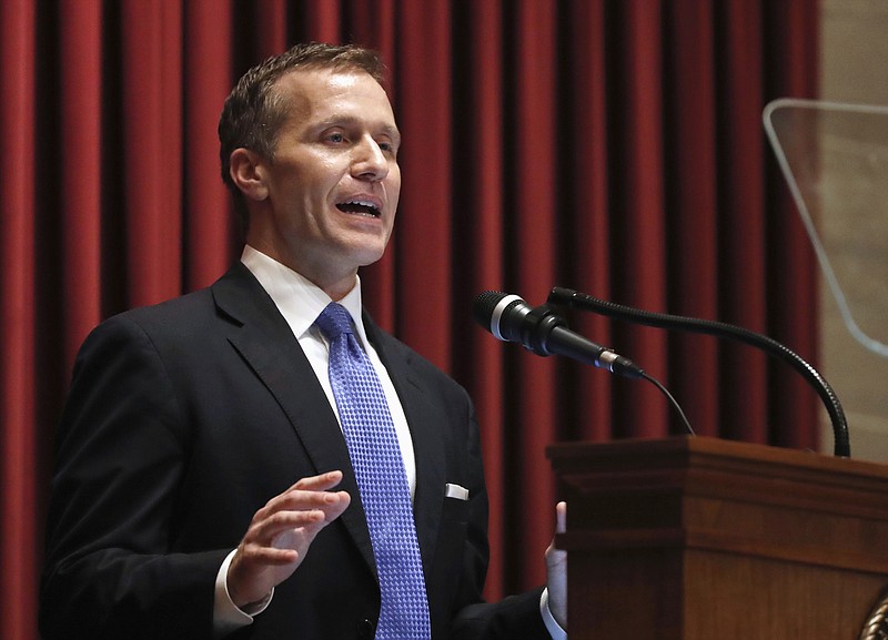 FILE - In this Jan. 10, 2018, file photo, Missouri Gov. Eric Greitens delivers the annual State of the State address to a joint session of the House and Senate in Jefferson City, Mo. Greitens appears to be bracing for a fight to preserve his political life after admitting to an extramarital affair but denying anything more. Greitens met Thursday, Jan. 11, 2018, with Cabinet members and placed calls to rally support while his attorney issued firm denials to a smattering of allegations related to the affair. (AP Photo/Jeff Roberson, File)
