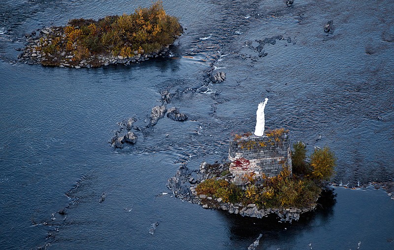 This Oct. 23, 2015, aerial photo, shows a replica Statue of Liberty on the Susquehanna River near Dauphin, Pa. When a 17.5-foot Statue of Liberty replica materialized on the Susquehanna in central Pennsylvania, it was a mystery. Now, 30 years later, the statue's origin is well known, but what does Lady Liberty signify to the people in this community? (Dan Gleiter/PennLive.com via AP)