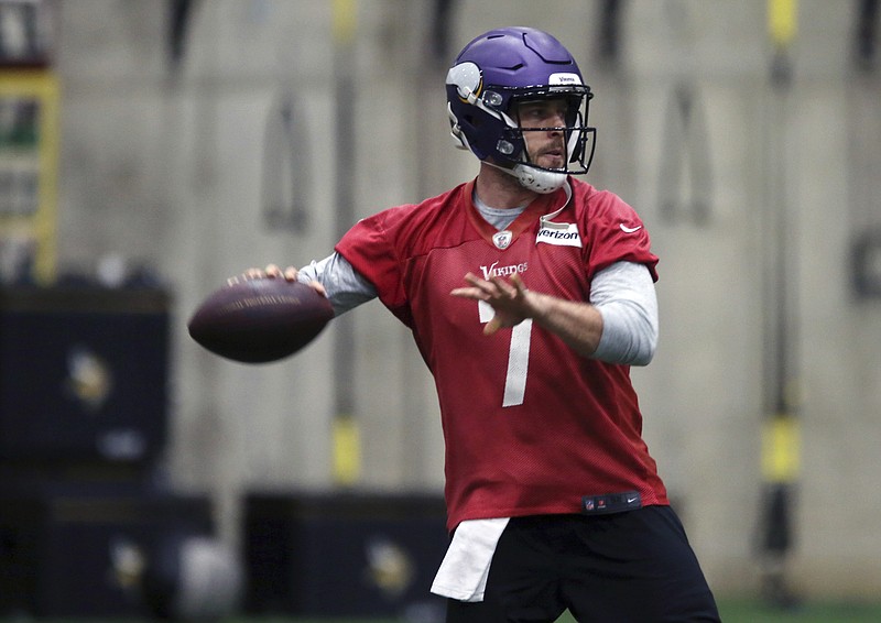 In this Jan. 11, 2018, photo, Minnesota Vikings NFL quarterback Case Keenum looks to throw a pass during football practice warmups in Eden Prairie, Minn. Lightly recruited out of high school and undrafted out of college, Keenum has kept on proving perceptions about a 6-foot-1 quarterback wrong. Once a career backup, Keenum has quickly become perhaps the NFL's best success story of 2017 by taking over for the Minnesota Vikings and leading them within two wins of playing the Super Bowl on home turf.