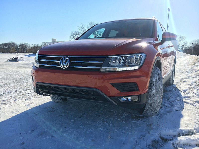 The 2018 Volkswagen Tiguan SE with AWD in Habanero Orange paint coat is powered by a revised 2-liter turbocharged 4-cylinder engine with variable valve timing. It's longer and heavier than the outgoing model, yet more fuel efficient and powerful. The compact crossover is pictured December 30, 2017, in Arlington Heights, Ill. (Robert Duffer/Chicago Tribune/TNS)