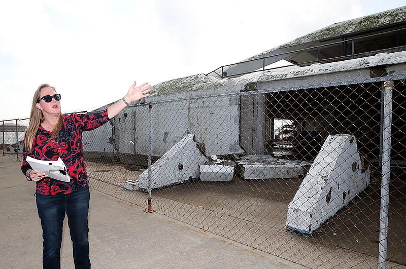 In a Friday, Dec. 23, 2017 photo, Sheryl Rozier, project manager for the Galveston Island Park Board of Trustees, talks about the damage to the Seawolf Park Pavilion caused by Hurricane Ike in 2008. A decision to repair the pavilion or demolish and rebuild it has been delayed by a review of city assets.